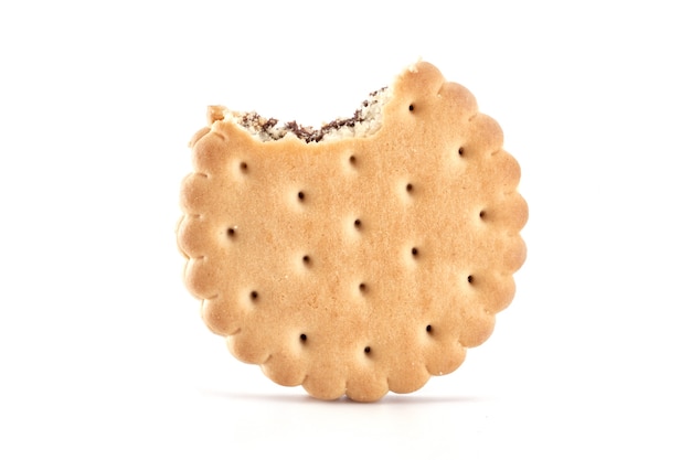 Round bitten cracker with filling isolated on white