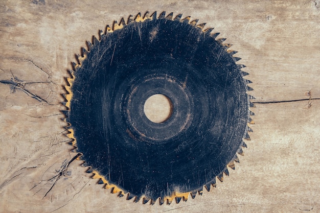 Round blade circular saw on the background of the wooden\
table