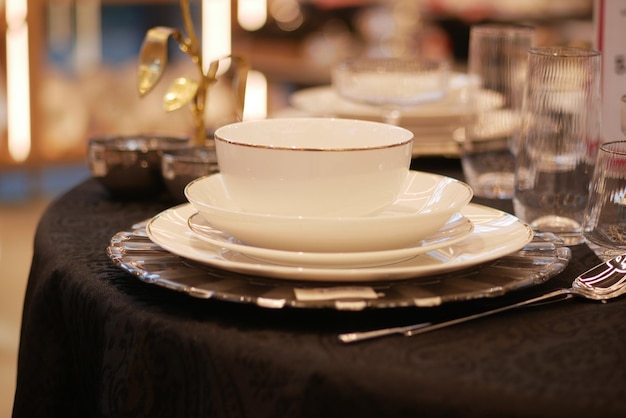 Round bowl or ceramic plate on napkin on wooden table