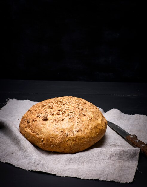 Round bread from rye flour with sunflower seeds 