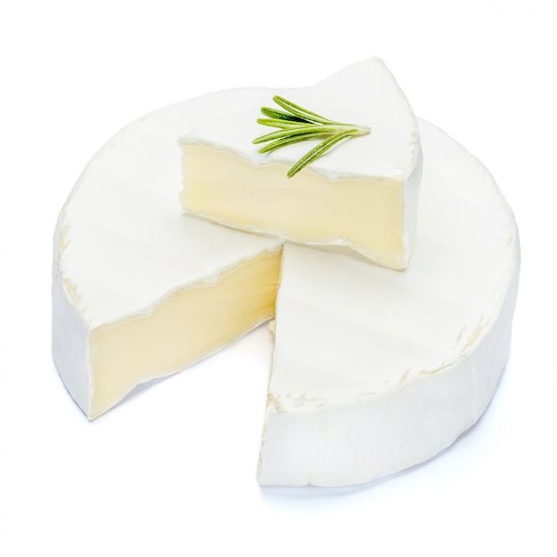 Photo round brie or camembert cheese on a white table