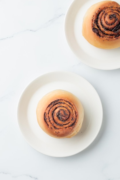 Round buns with poppy seeds