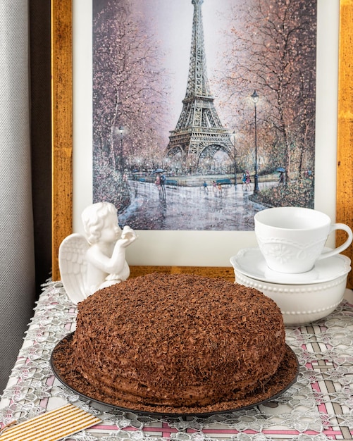 Round cake covered with chocolate icing decorated with chocolate chips homemade baking