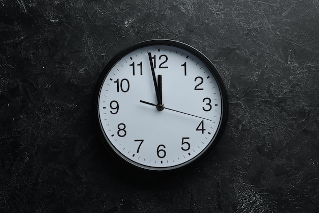 round clock with numbers on old background
