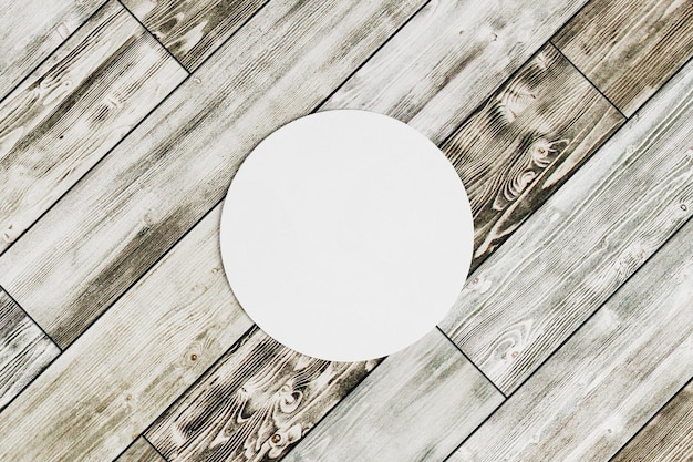 Round coaster on wooden background