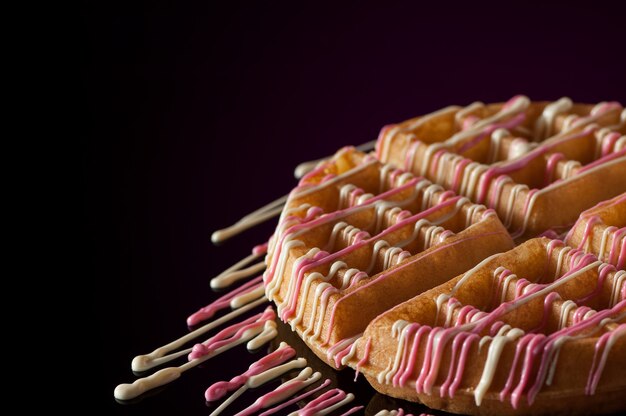 Round cookies on a dark background with reflection