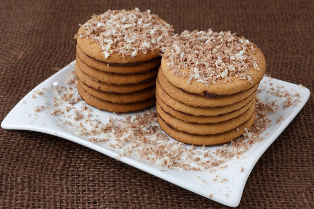 Round cookies with chocolate in a plate