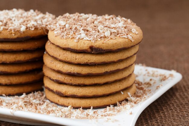 Round cookies with chocolate in a plate