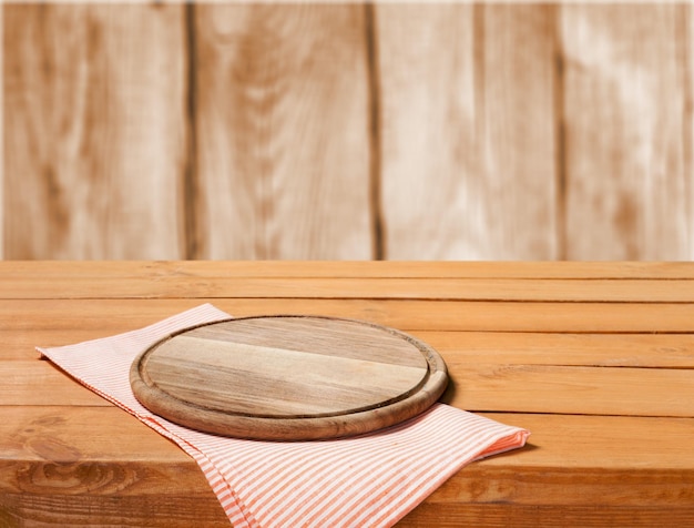 Round cutting board and checkered napkin