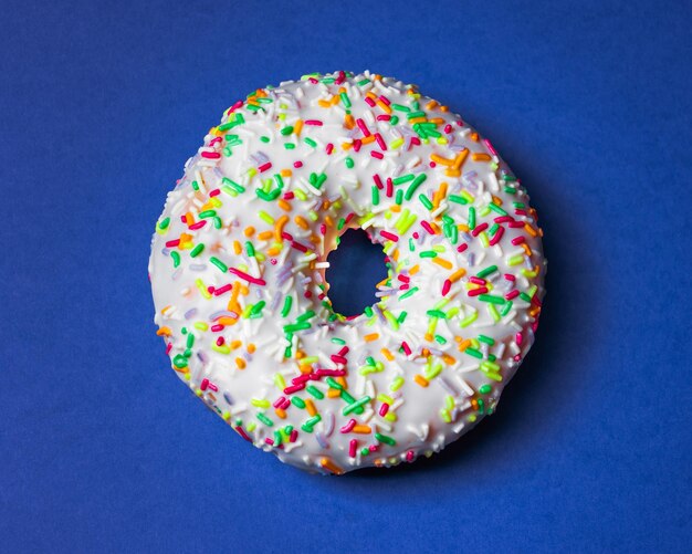 Round donut with icing and sprinkles