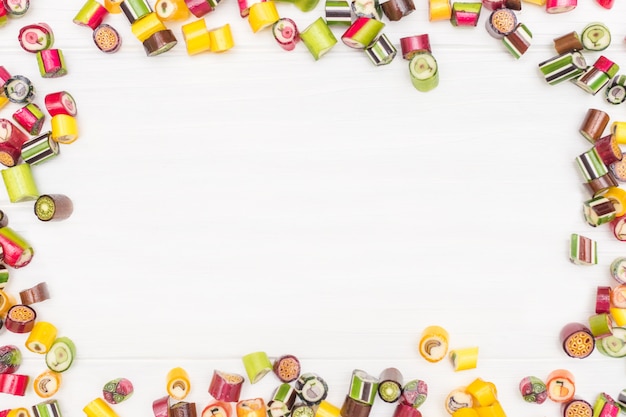 A round frame made of colored caramel candies