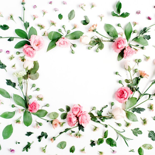 Round frame made of pink and beige roses 