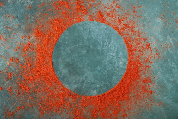 Round frame made of red paprika powder