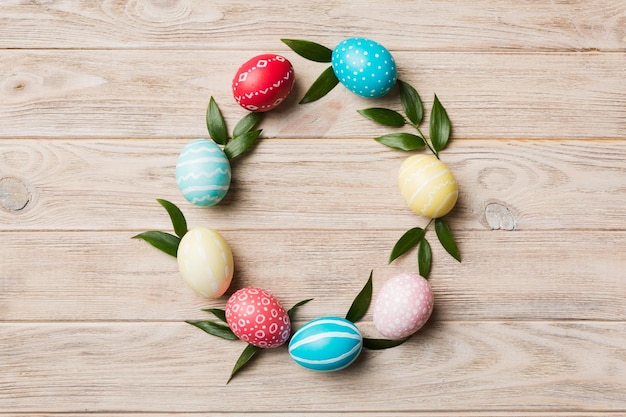 Round frame Multi colors Easter eggs on colored background Pastel color Easter eggs holiday concept with empty space for you design