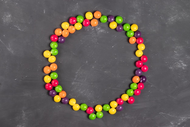 Round frame of multicolored round candies