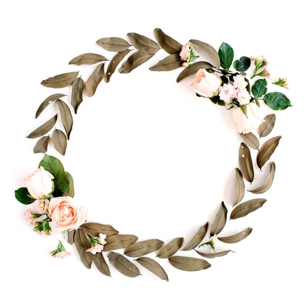 Photo round frame wreath with roses and dried leaves isolated on white