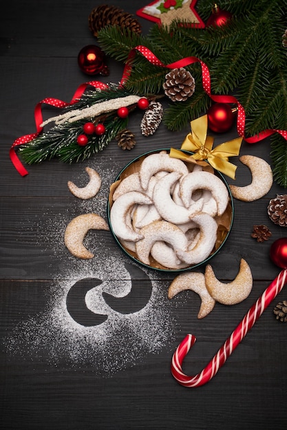 Round gift box full of traditional german or austrian vanillekipferl vanilla kipferl cookies