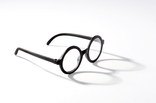 Round glasses with shadow on white background