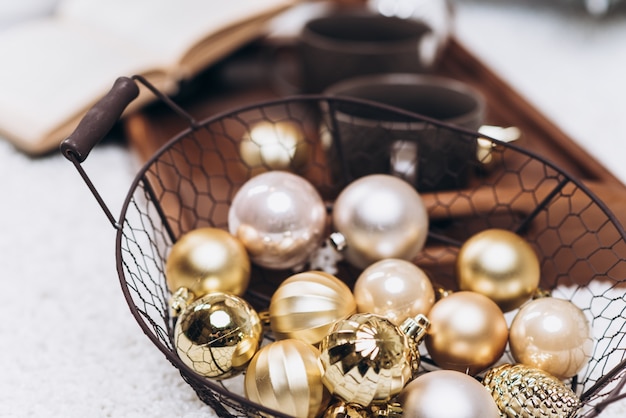 Round golden Christmas toys on the ground. Top view