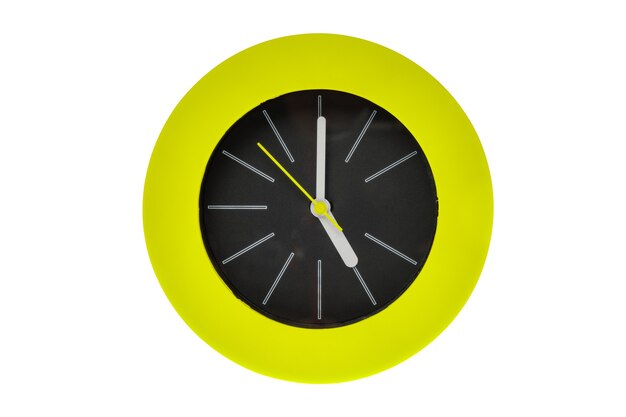 Round modern clock with white stripe, yellow clock hands pointing at the center possess time, five pm or am. Middle of the clock is black surrounded by green circle flame. Isolated on white