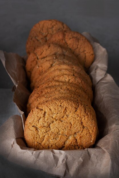 Round oatmeal cookies in craft paper closeup