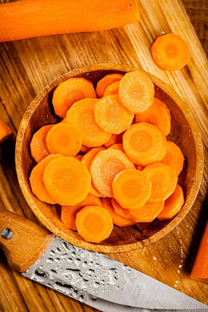 Round pieces of fresh carrots on a plate