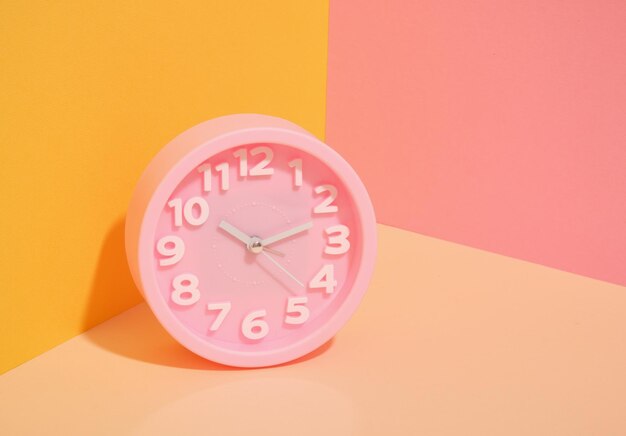 Photo round pink clock style and interior work or study time copy space for text