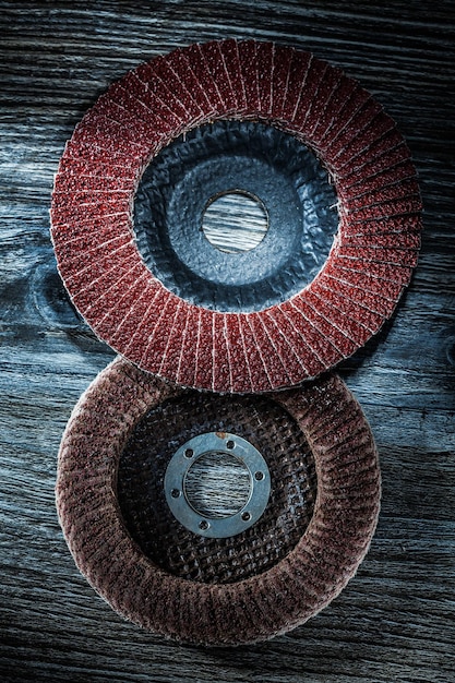 Round polishing discs on vintage wooden board.