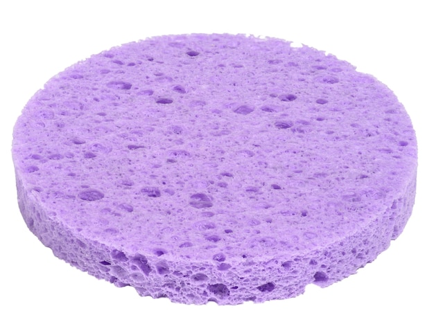 Round purple makeup sponge on a white isolated background