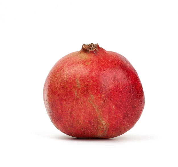 Round red ripe pomegranate fruit in peel isolated