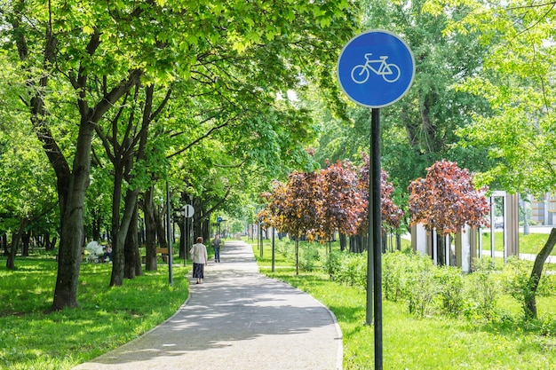 Round road sign on a blue background bike path