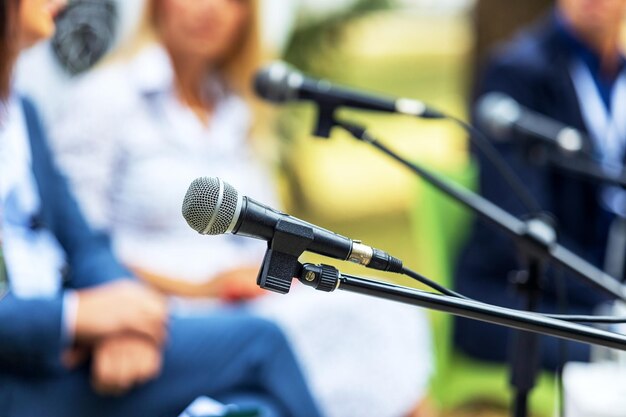 Round table event or business conference close-up of microphone