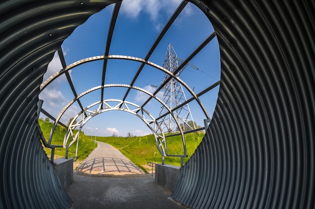 Round tunnel footpath on blue sky background