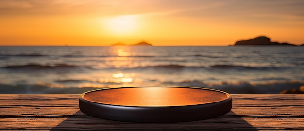 A round wooden tray lies on a wooden table with a sunset on the beach in the background