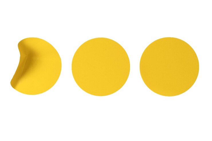Photo round yellow stickers blank tags labels isolated on a white background