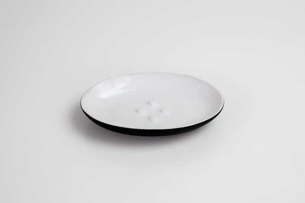 Rounded black and white empty dish