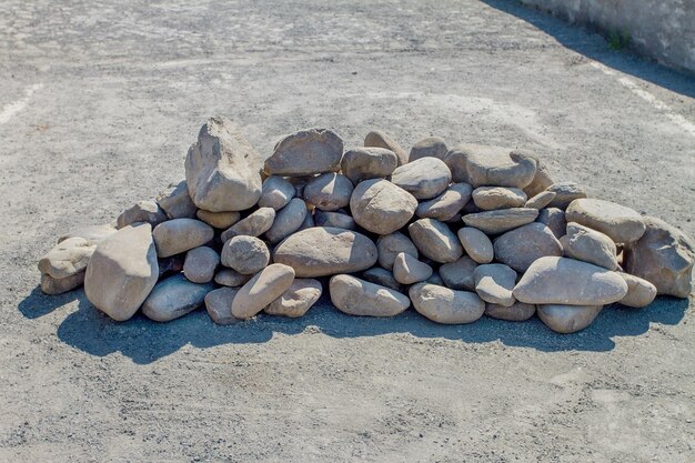 Rounded stones piled in the middle of the road