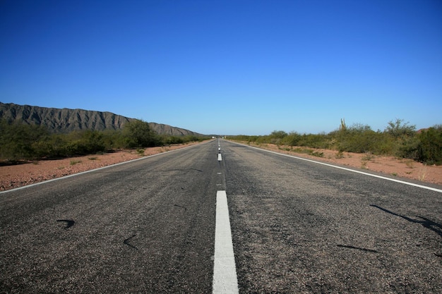 Route in an arid area with mountainsxA