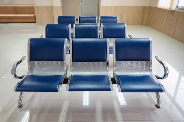 Row of aluminium blue bench chair in reception at hospital