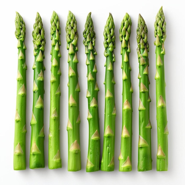 a row of asparagus spears on a white surface