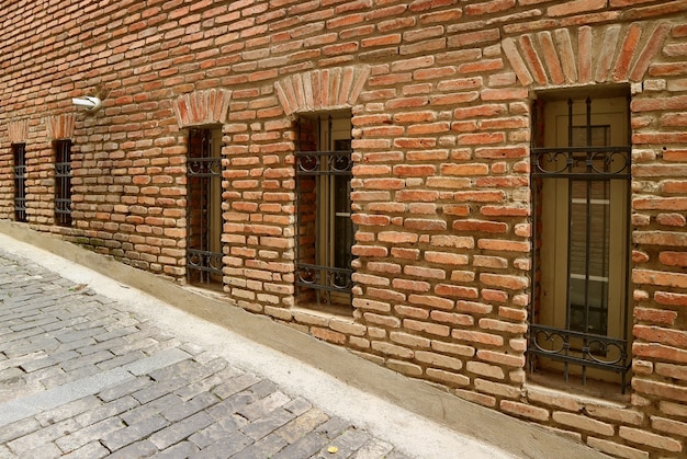 Row of beautiful windows on the old brick wall