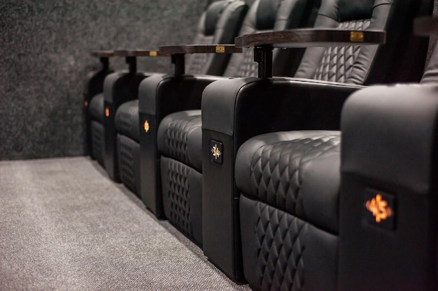 A row of black seats with the number 4 on them