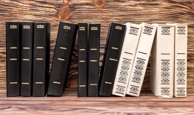 Photo row of books on the wooden bookshelf