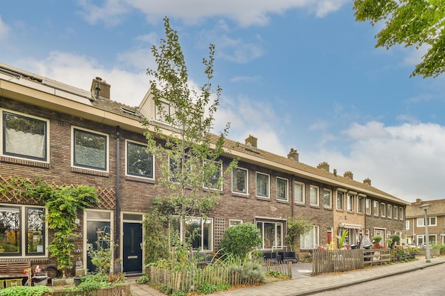 A row of brick houses with a street in front