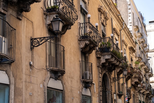 A row of buildings with balconies and awnings