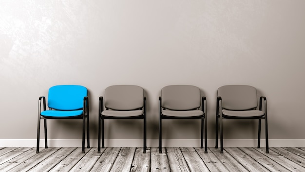 Row of Chairs on Wooden Floor Against a Wall