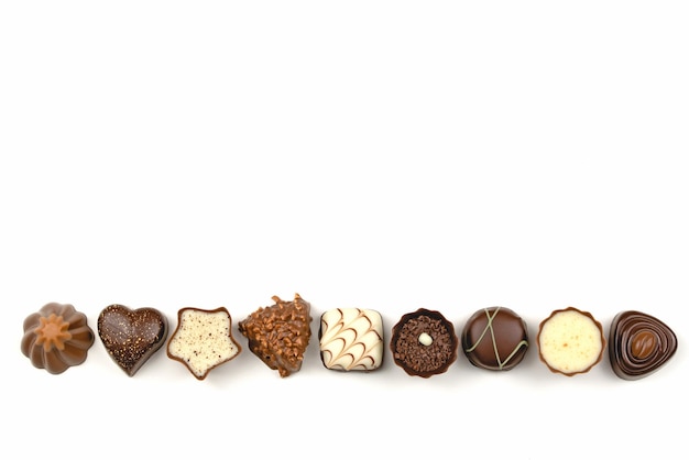 A row of chocolates with hearts and the words love on the top