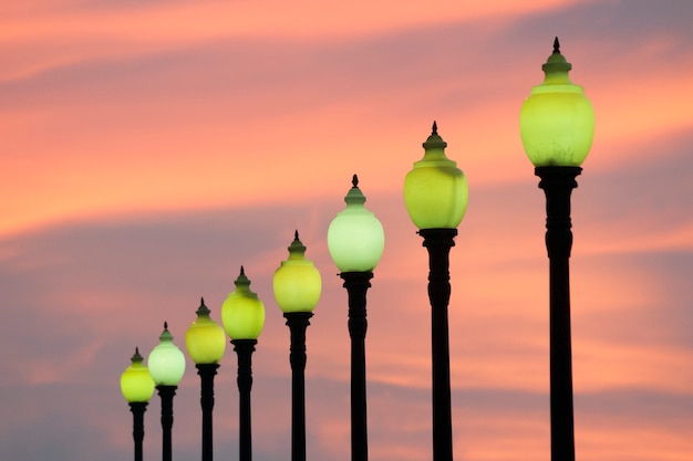 Row of classic style city lamps over twilight sky in Barcelona, Spain