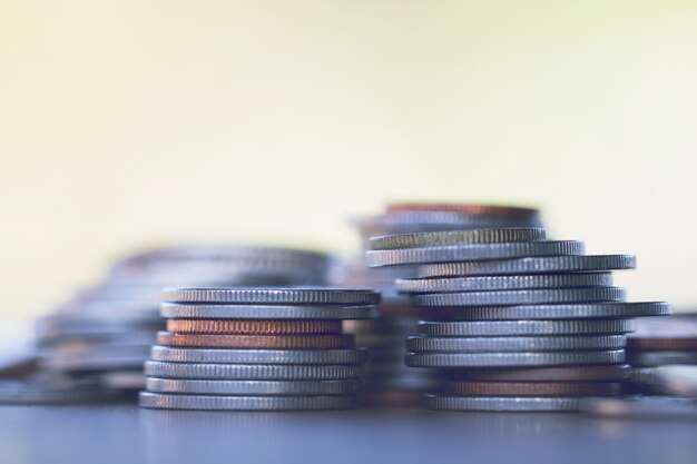 Row of coins on wood background for finance and Saving concept,Investment, Economy, Soft focus