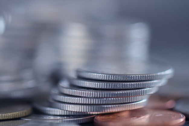 Row of coins on wood background for finance